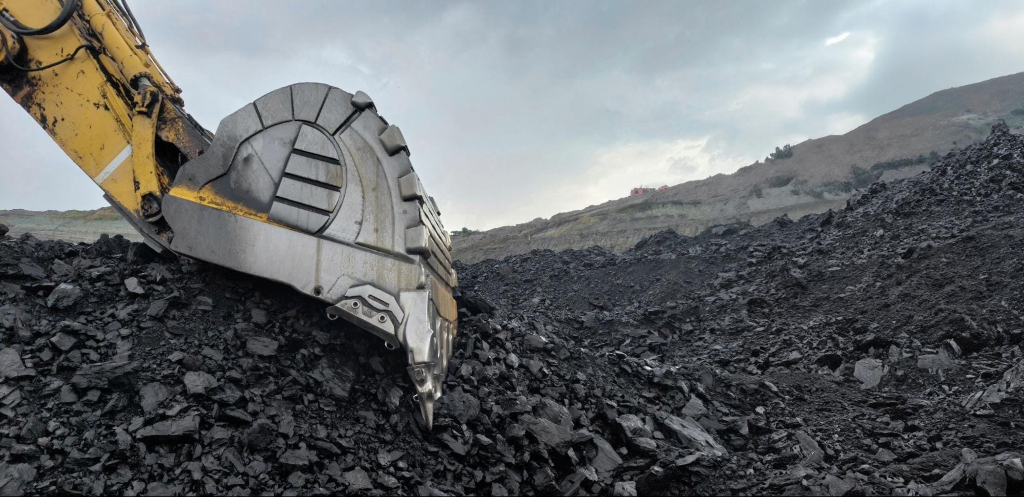 Caçamba de mineração com QUARD e QUEND: maior vida útil